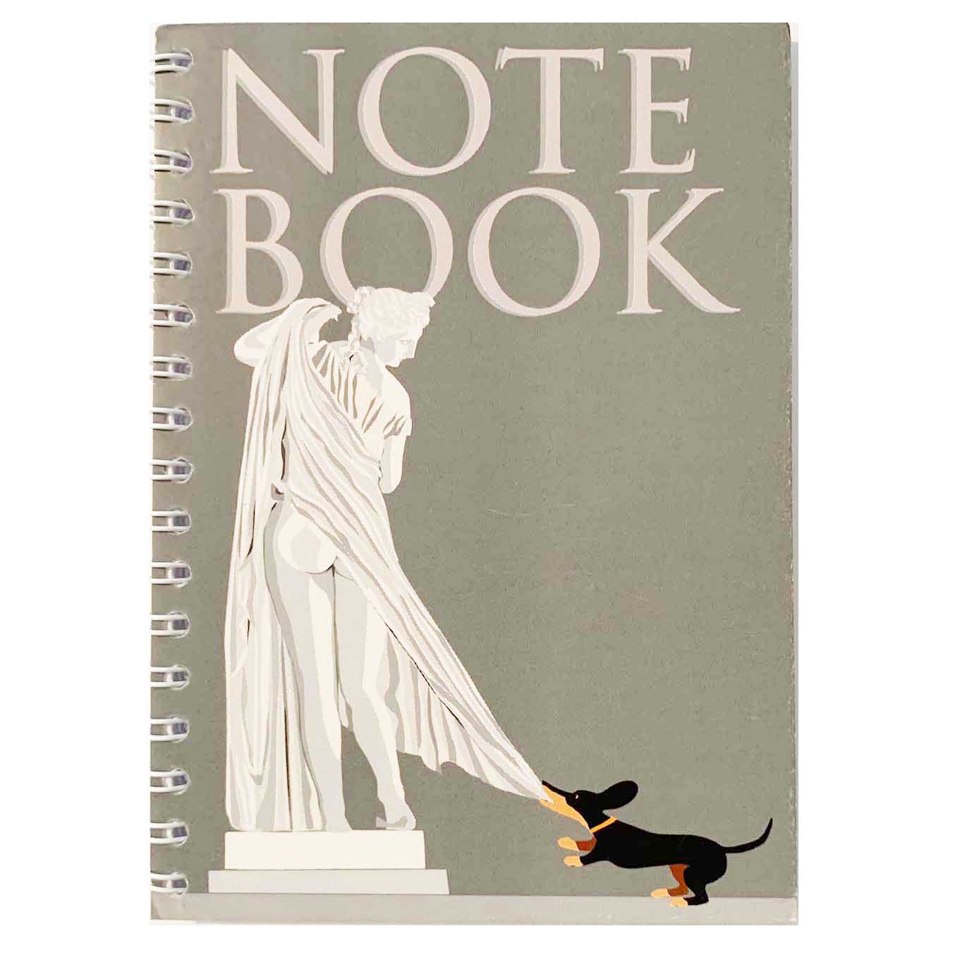 Spiral bound notebook with the cover showing a statue of Venus and a small dachshund cheekily pulling her robe.